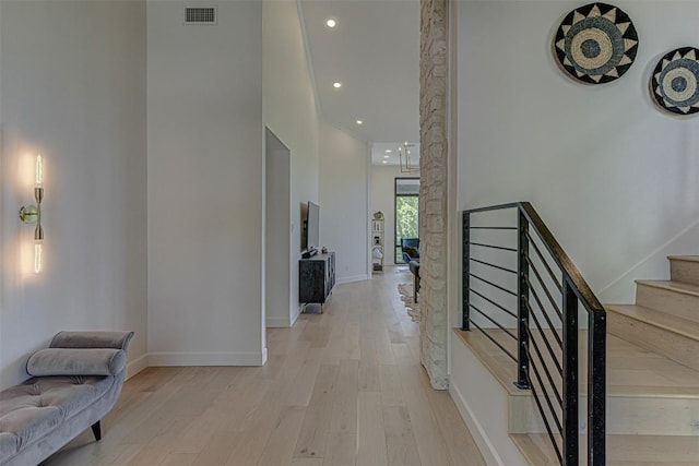 3502 Native Dancer Cv, Austin, TX 78746 - hallway featuring light wood finished floors, stairs, baseboards, and recessed lighting