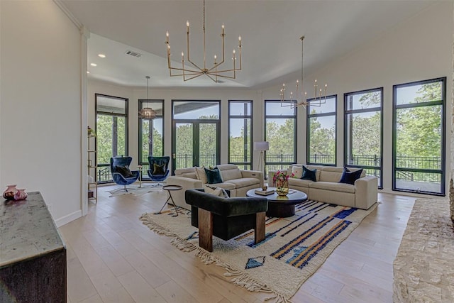 3502 Native Dancer Cv, Austin, TX 78746 - living area with a chandelier, light wood finished floors, a towering ceiling, and recessed lighting
