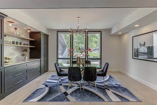 3502 Native Dancer Cv, Austin, TX 78746 - dining space featuring a chandelier, baseboards, light wood-style floors, and recessed lighting