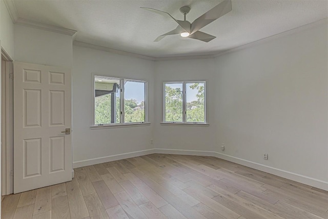 3502 Native Dancer Cv, Austin, TX 78746 - empty room featuring crown molding, a ceiling fan, baseboards, and light wood-type flooring