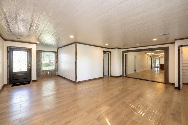 1229 State Highway 304, Gonzales, TX 78629 - unfurnished living room featuring a chandelier, light wood-style flooring, crown molding, and recessed lighting