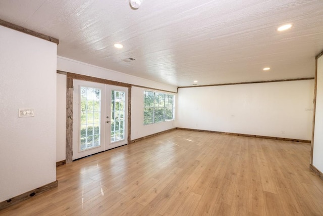 1229 State Highway 304, Gonzales, TX 78629 - unfurnished room with french doors, light wood finished floors, recessed lighting, and crown molding