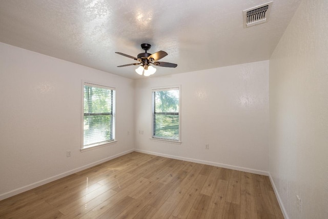 1229 State Highway 304, Gonzales, TX 78629 - spare room featuring ceiling fan and light wood-style flooring