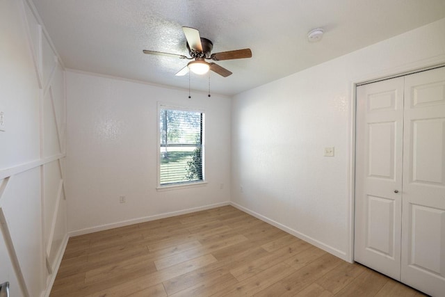 1229 State Highway 304, Gonzales, TX 78629 - unfurnished room featuring ceiling fan, light wood-style flooring, and a smoke detector