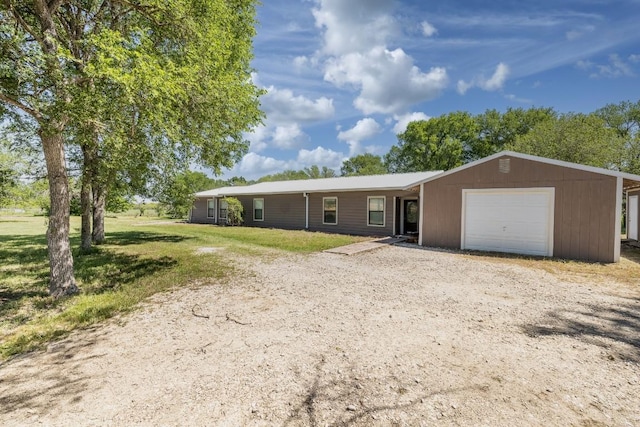 1229 State Highway 304, Gonzales, TX 78629 - ranch-style house featuring dirt driveway, a garage, and a front yard