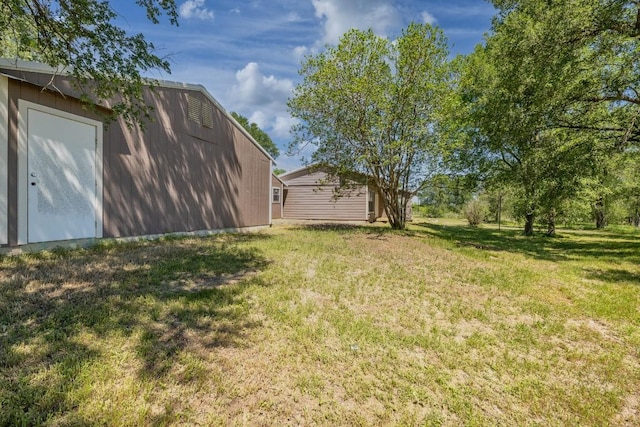 1229 State Highway 304, Gonzales, TX 78629 - view of green lawn with an outbuilding