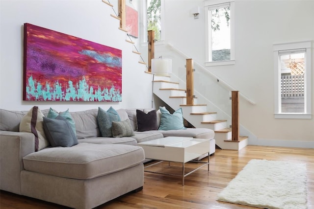 606 E 42nd St, Austin, TX 78751 - living room with wood finished floors, stairway, and baseboards