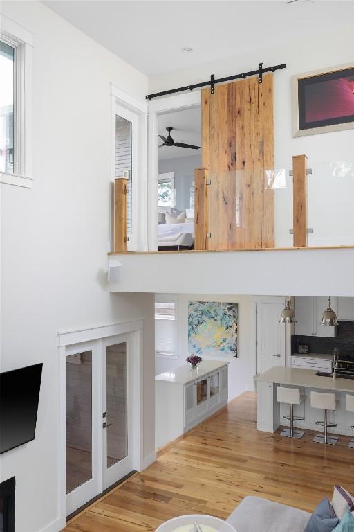 606 E 42nd St, Austin, TX 78751 - living area featuring wood finished floors, a ceiling fan, and french doors