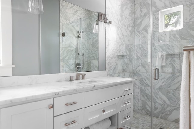 606 E 42nd St, Austin, TX 78751 - bathroom featuring vanity and a marble finish shower
