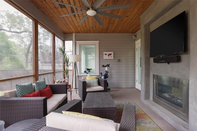 606 E 42nd St, Austin, TX 78751 - sunroom / solarium with a ceiling fan and an outdoor living space with a fireplace