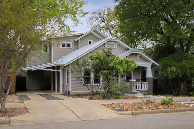 606 E 42nd St, Austin, TX 78751 - view of front of property with covered porch, driveway, and a carport