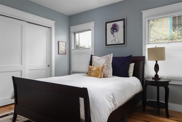 606 E 42nd St, Austin, TX 78751 - bedroom featuring wood finished floors and a closet