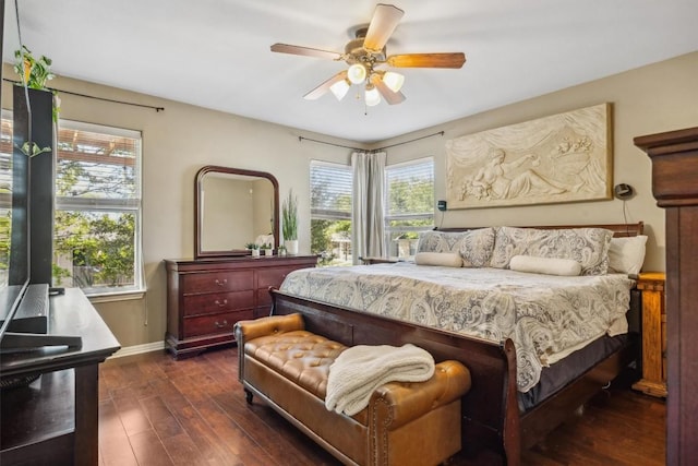 6220 Seville Dr, Austin, TX 78724 - bedroom featuring dark wood-type flooring, baseboards, and a ceiling fan
