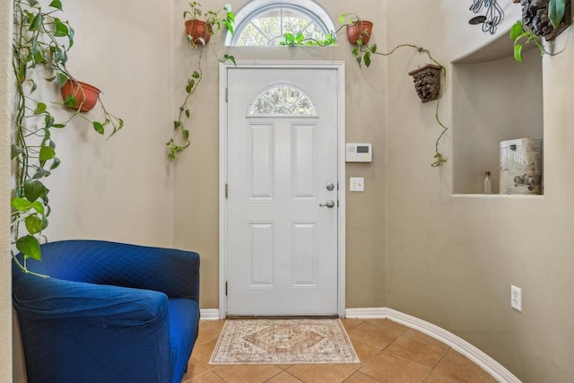 6220 Seville Dr, Austin, TX 78724 - entryway featuring baseboards and light tile patterned flooring