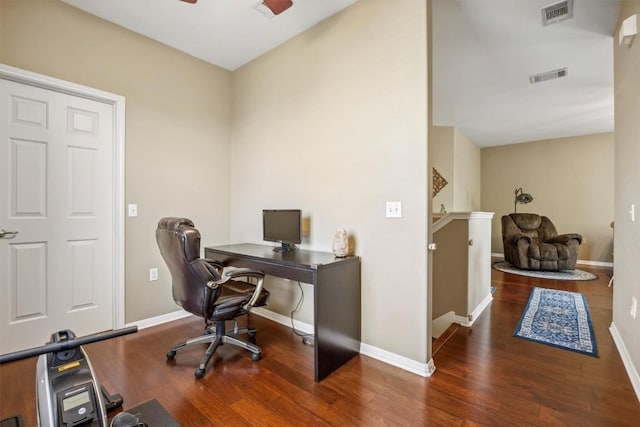 6220 Seville Dr, Austin, TX 78724 - home office with wood finished floors, baseboards, and visible vents
