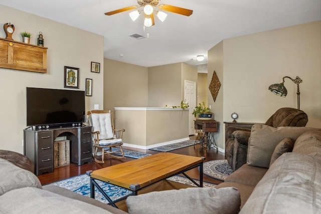 6220 Seville Dr, Austin, TX 78724 - living room with visible vents, baseboards, a ceiling fan, and wood finished floors