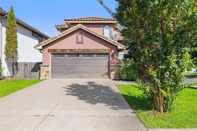 6220 Seville Dr, Austin, TX 78724 - mediterranean / spanish-style house with concrete driveway, stucco siding, a tiled roof, and stone siding