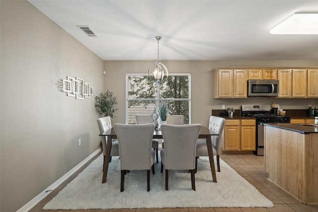6220 Seville Dr, Austin, TX 78724 - dining space with a chandelier and light tile patterned flooring