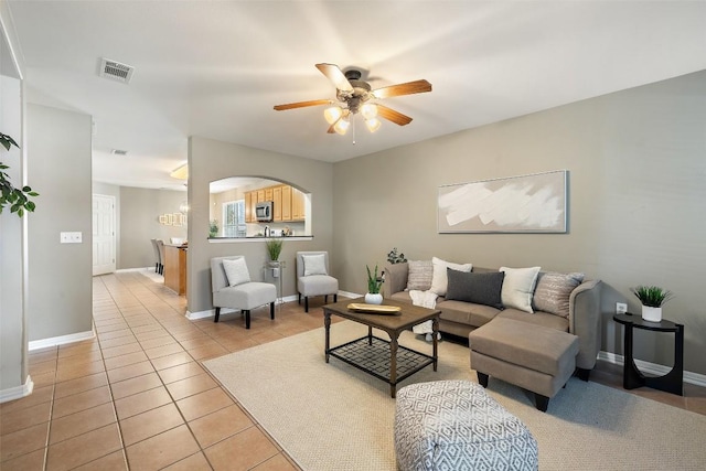 6220 Seville Dr, Austin, TX 78724 - living room with a ceiling fan and light tile patterned floors