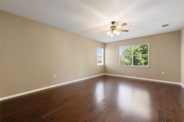 6220 Seville Dr, Austin, TX 78724 - empty room with a ceiling fan and dark wood finished floors