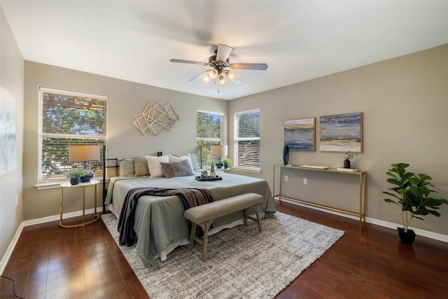 6220 Seville Dr, Austin, TX 78724 - bedroom with hardwood / wood-style floors, multiple windows, and a ceiling fan