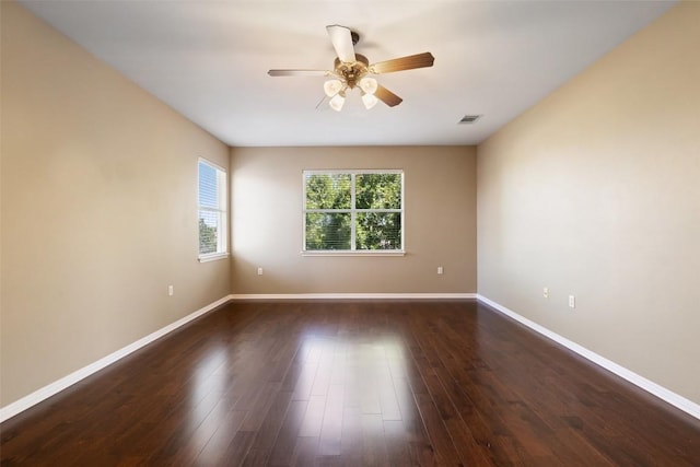 6220 Seville Dr, Austin, TX 78724 - empty room with ceiling fan and wood finished floors