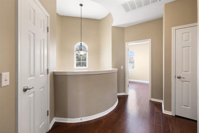6220 Seville Dr, Austin, TX 78724 - corridor with dark wood-style flooring and baseboards