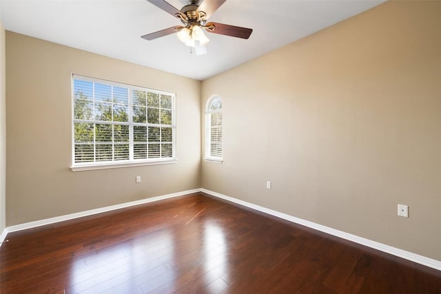 6220 Seville Dr, Austin, TX 78724 - spare room with wood finished floors and a ceiling fan
