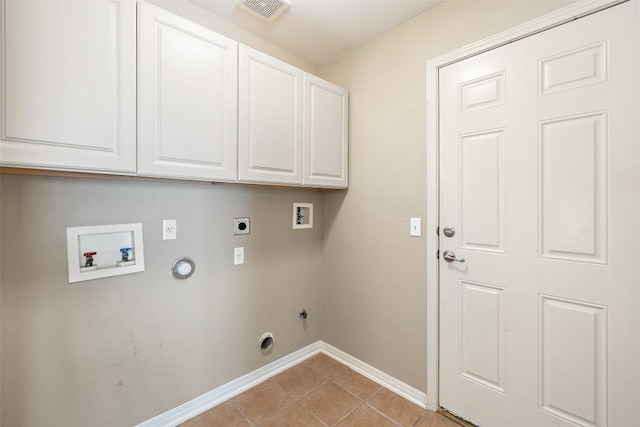 6220 Seville Dr, Austin, TX 78724 - laundry area featuring hookup for a gas dryer, washer hookup, electric dryer hookup, cabinet space, and light tile patterned floors