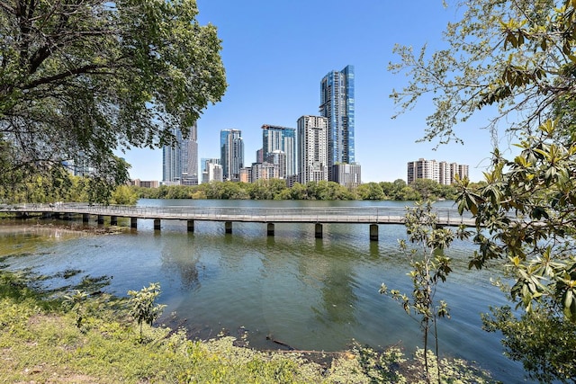 500 E Riverside Dr Unit 146, Austin, TX 78704 - water view featuring city skyline and a notable bridge