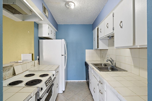 500 E Riverside Dr Unit 146, Austin, TX 78704 - kitchen with white appliances, tile countertops, a textured ceiling, white cabinetry, and backsplash