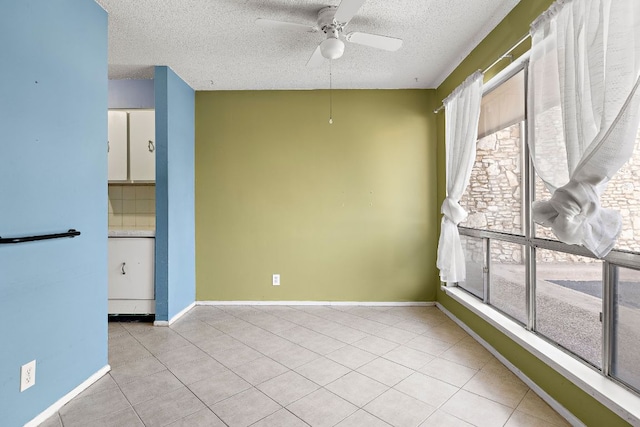 500 E Riverside Dr Unit 146, Austin, TX 78704 - empty room featuring a textured ceiling, a ceiling fan, and light tile patterned floors