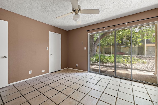 500 E Riverside Dr Unit 146, Austin, TX 78704 - unfurnished room featuring light tile patterned flooring, ceiling fan, and a textured ceiling