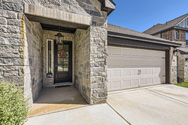 116 Angel Oak Way, San Marcos, TX 78666 - property entrance featuring concrete driveway, a garage, and stone siding