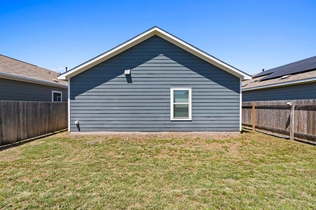3313 Lodgepole Dr, Austin, TX 78744 - back of property with a fenced backyard and a lawn