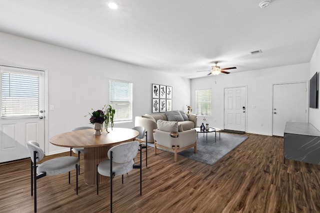 3313 Lodgepole Dr, Austin, TX 78744 - dining room featuring dark wood-type flooring, visible vents, baseboards, and a ceiling fan