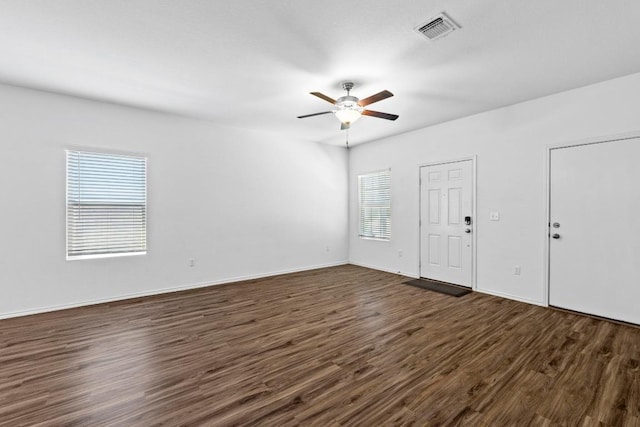 3313 Lodgepole Dr, Austin, TX 78744 - entrance foyer with visible vents, dark wood-style flooring, baseboards, and ceiling fan