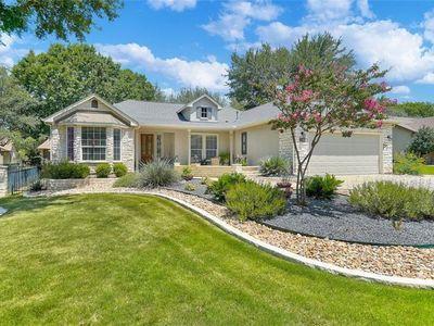122 Camp Dr, Georgetown, TX 78633 - ranch-style home with an attached garage and driveway