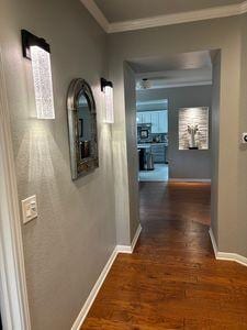 122 Camp Dr, Georgetown, TX 78633 - hallway with ornamental molding, baseboards, and wood finished floors