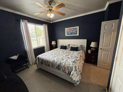 122 Camp Dr, Georgetown, TX 78633 - carpeted bedroom featuring crown molding and ceiling fan