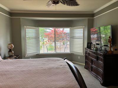 122 Camp Dr, Georgetown, TX 78633 - bedroom with light carpet, crown molding, and baseboards