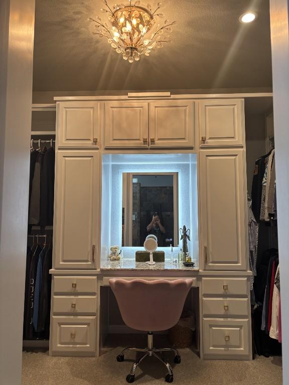 122 Camp Dr, Georgetown, TX 78633 - office space featuring carpet flooring, a chandelier, and built in study area