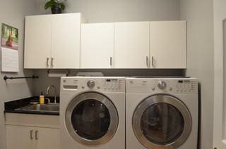 122 Camp Dr, Georgetown, TX 78633 - laundry area with cabinet space and separate washer and dryer