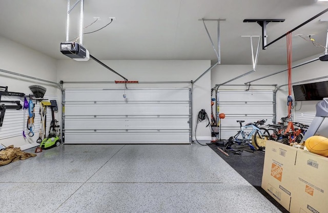 304 Ashburn Cv, Austin, TX 78738 - garage featuring a garage door opener