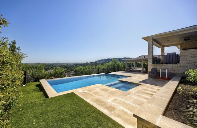 304 Ashburn Cv, Austin, TX 78738 - view of swimming pool with a ceiling fan, a patio, and a pool with connected hot tub