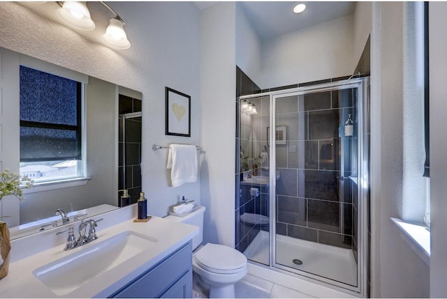 304 Ashburn Cv, Austin, TX 78738 - bathroom with a stall shower, vanity, and toilet