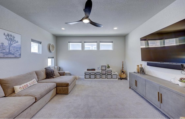 304 Ashburn Cv, Austin, TX 78738 - living room with light carpet, a ceiling fan, a textured ceiling, and recessed lighting