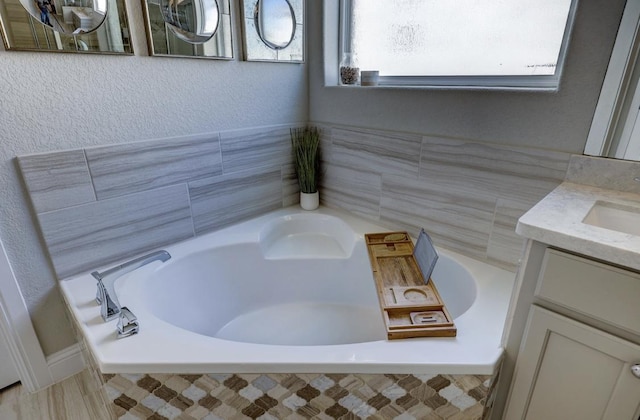 304 Ashburn Cv, Austin, TX 78738 - bathroom featuring vanity and a garden tub