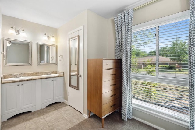 1405 Meadowmear Dr, Austin, TX 78753 - bathroom featuring double vanity and tile patterned floors