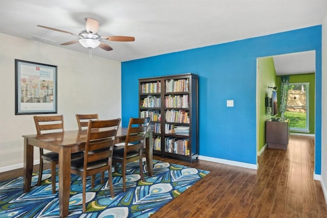 1405 Meadowmear Dr, Austin, TX 78753 - dining room with a ceiling fan, wood finished floors, and baseboards